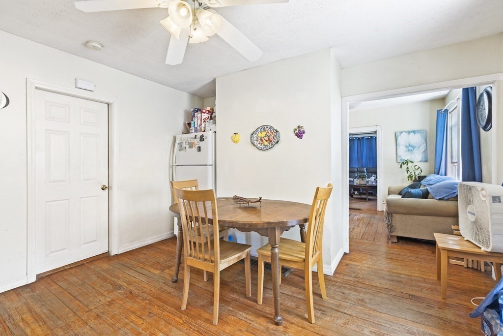 185 Stevens Street Fall River, MA 02721 - Photo 19 of 28 a view of a dining room with furniture wooden floor and chandelier