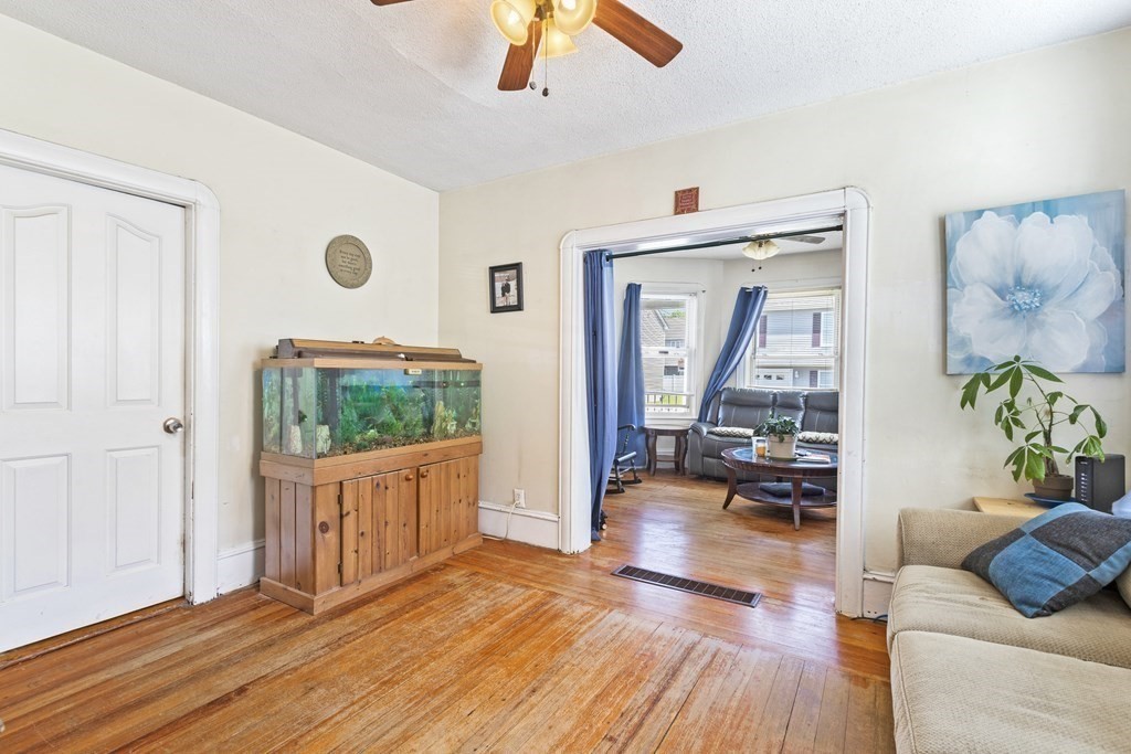 185 Stevens Street Fall River, MA 02721 - Photo 23 of 28 a living room with furniture and a flat screen tv