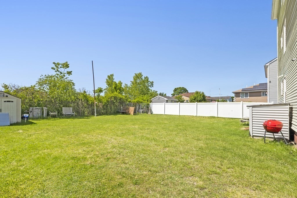 185 Stevens Street Fall River, MA 02721 - Photo 28 of 28 a backyard of a house with lots of green space