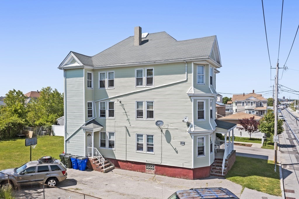 185 Stevens Street Fall River, MA 02721 - Photo 4 of 28 a front view of a house with a garden
