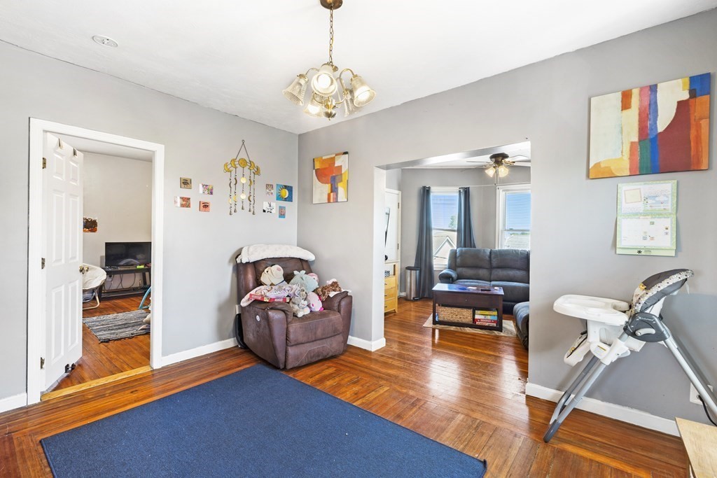 185 Stevens Street Fall River, MA 02721 - Photo 6 of 28 a living room with furniture and wooden floor