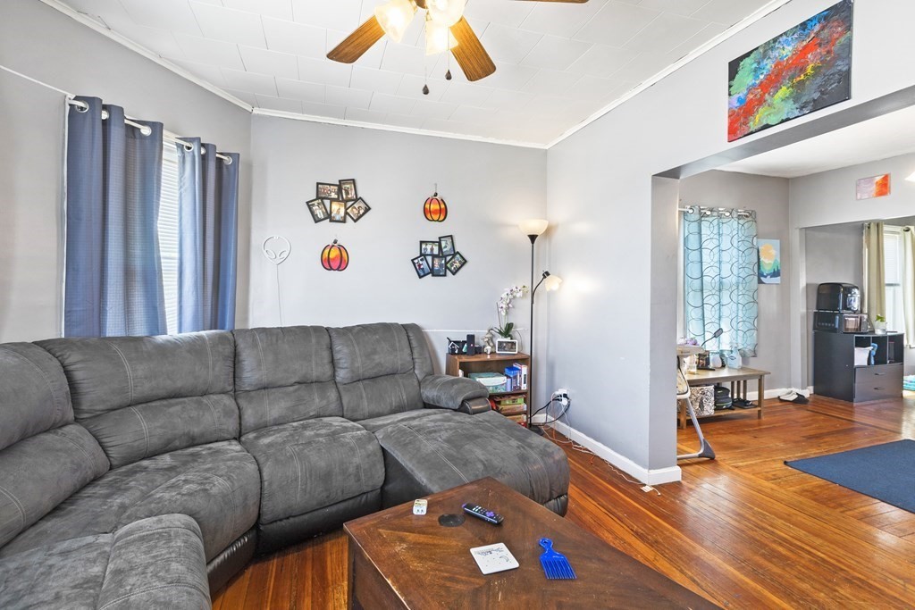 185 Stevens Street Fall River, MA 02721 - Photo 8 of 28 a living room with furniture and wooden floor
