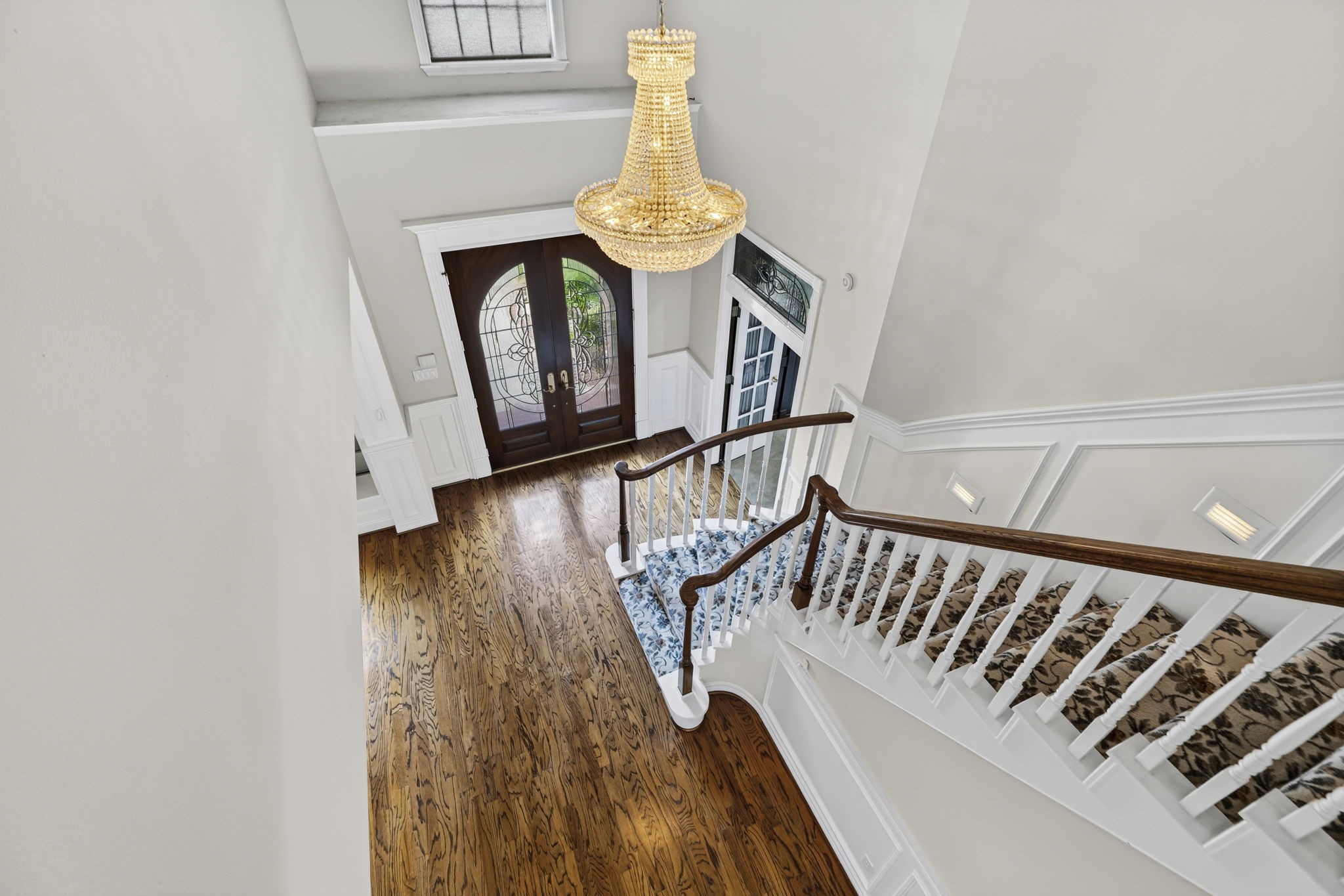18310 Pamela Way Spring, TX 77379 - Photo 5 of 42 Stunning crystal chandelier illuminating the grand staircase entrance.