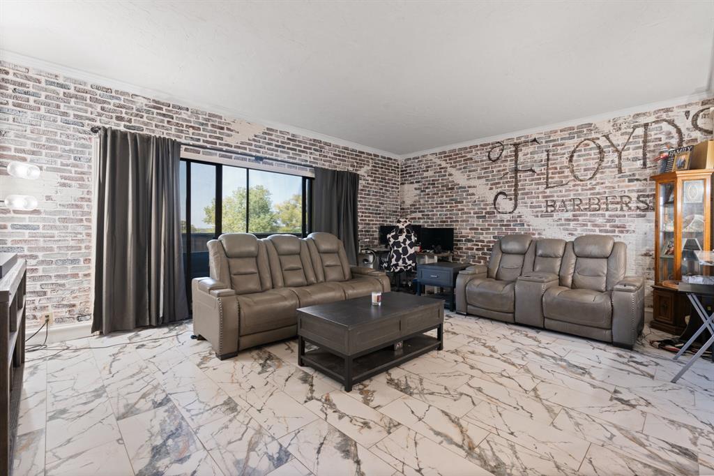 2100 Reflection Bay Drive Arlington, TX 76013 - Photo 3 of 20 a living room with furniture and a flat screen tv