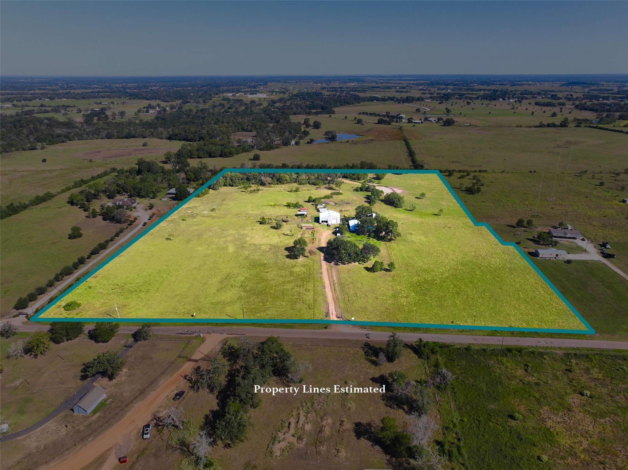 34478 Mayer Road Hempstead, TX 77445 - Photo 2 of 5 an aerial view of a tennis court