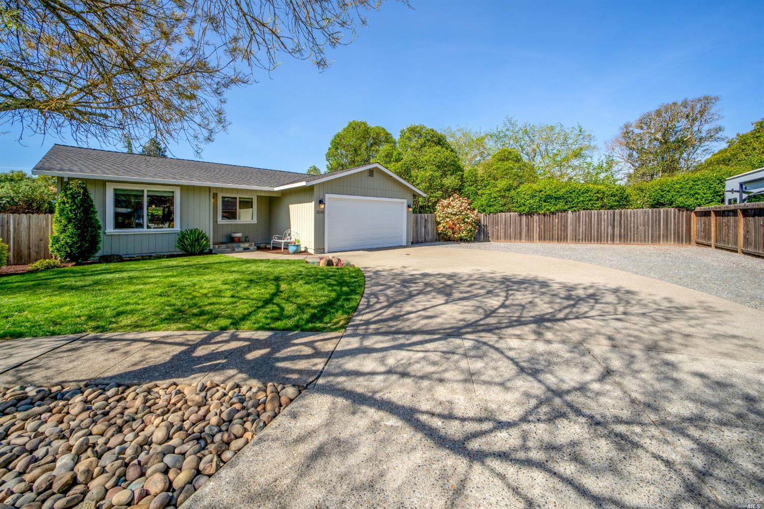 5016 Gregory Court Santa Rosa, CA 95409 - Photo 1 of 1 a front view of a house with a yard and a garage