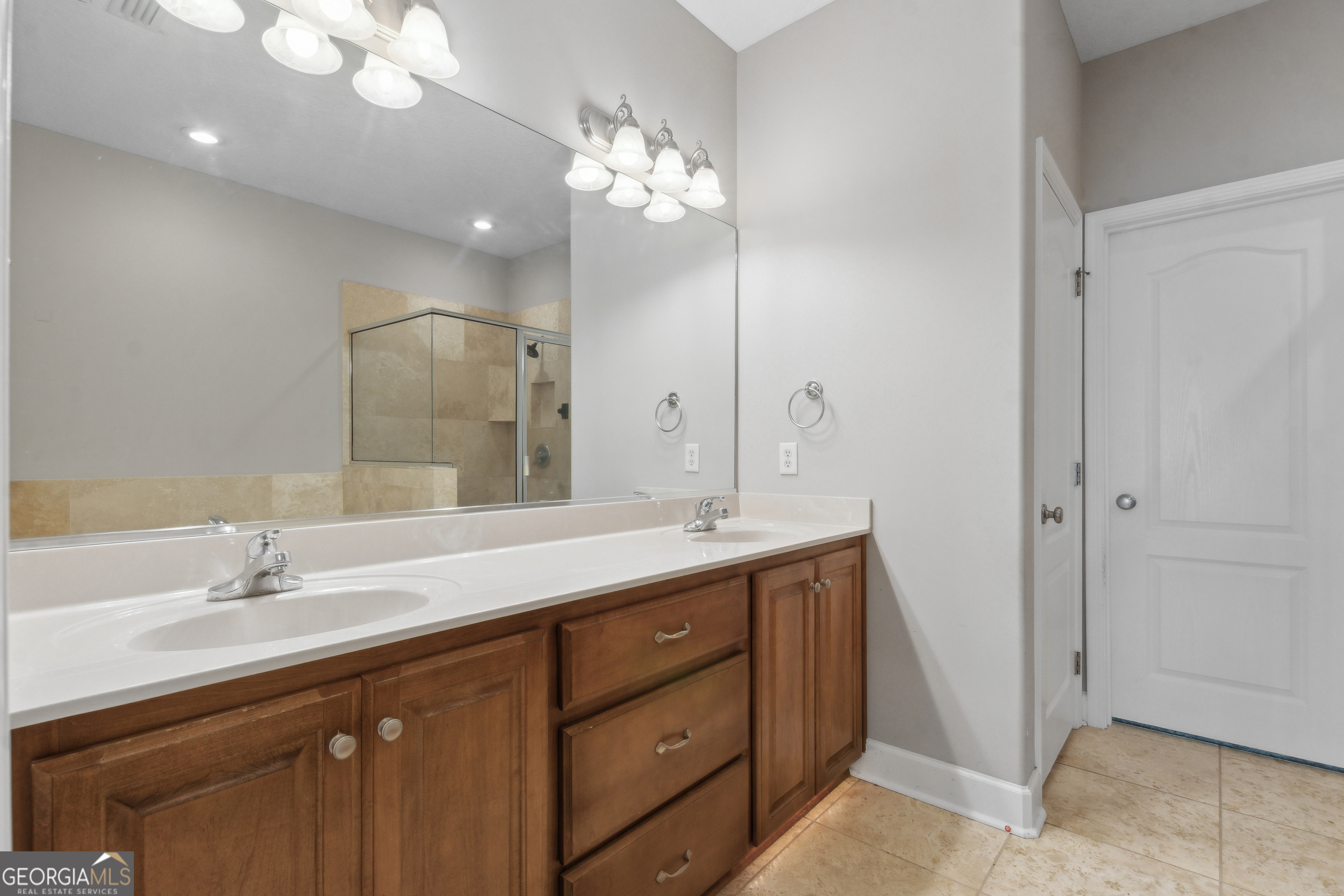 259 Laurel Landing Boulevard Kingsland, GA 31548 - Photo 17 of 43 a bathroom with a double vanity sink and a mirror