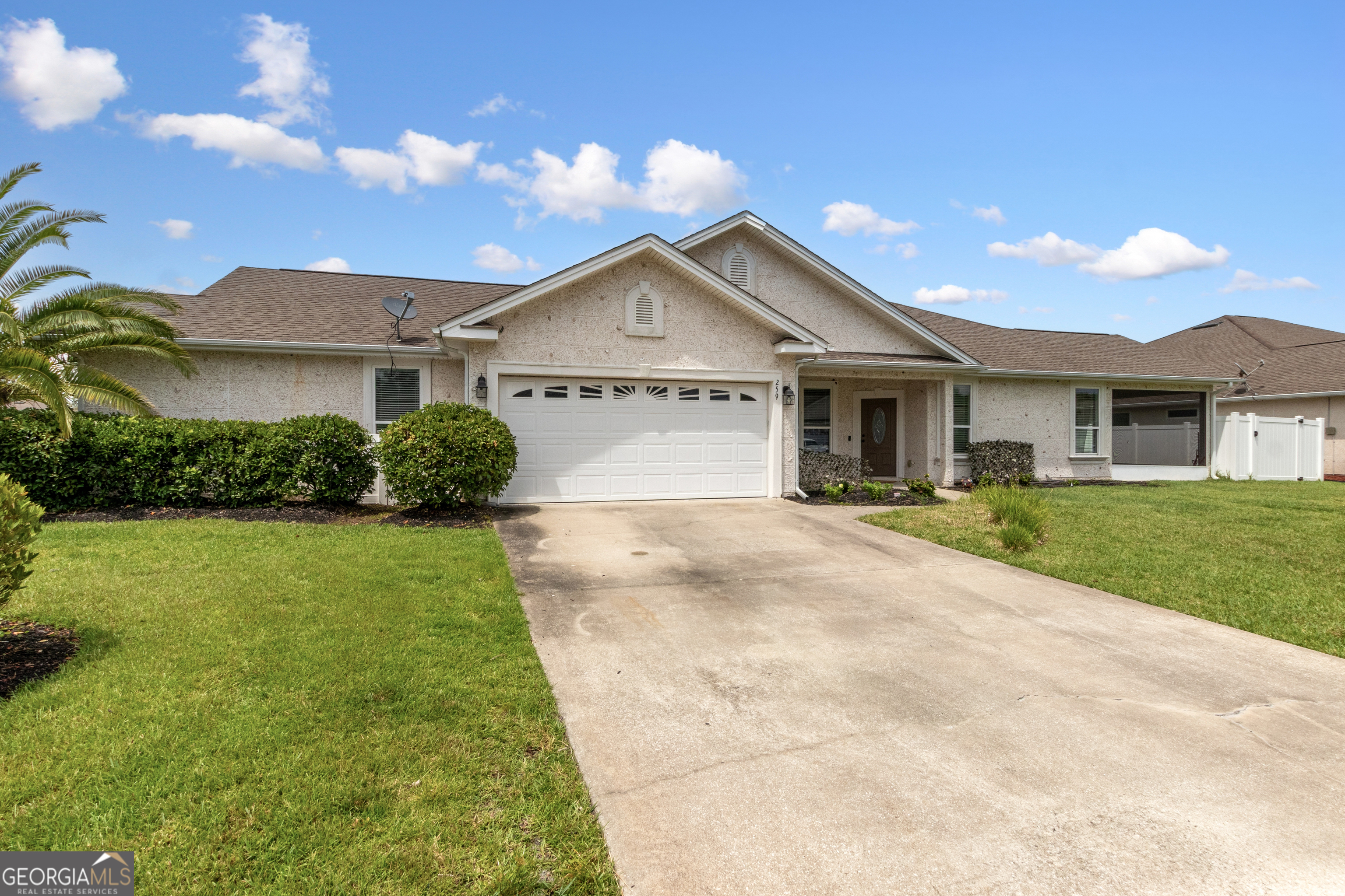 259 Laurel Landing Boulevard Kingsland, GA 31548 - Photo 2 of 43 a view of a house with a yard and potted plants