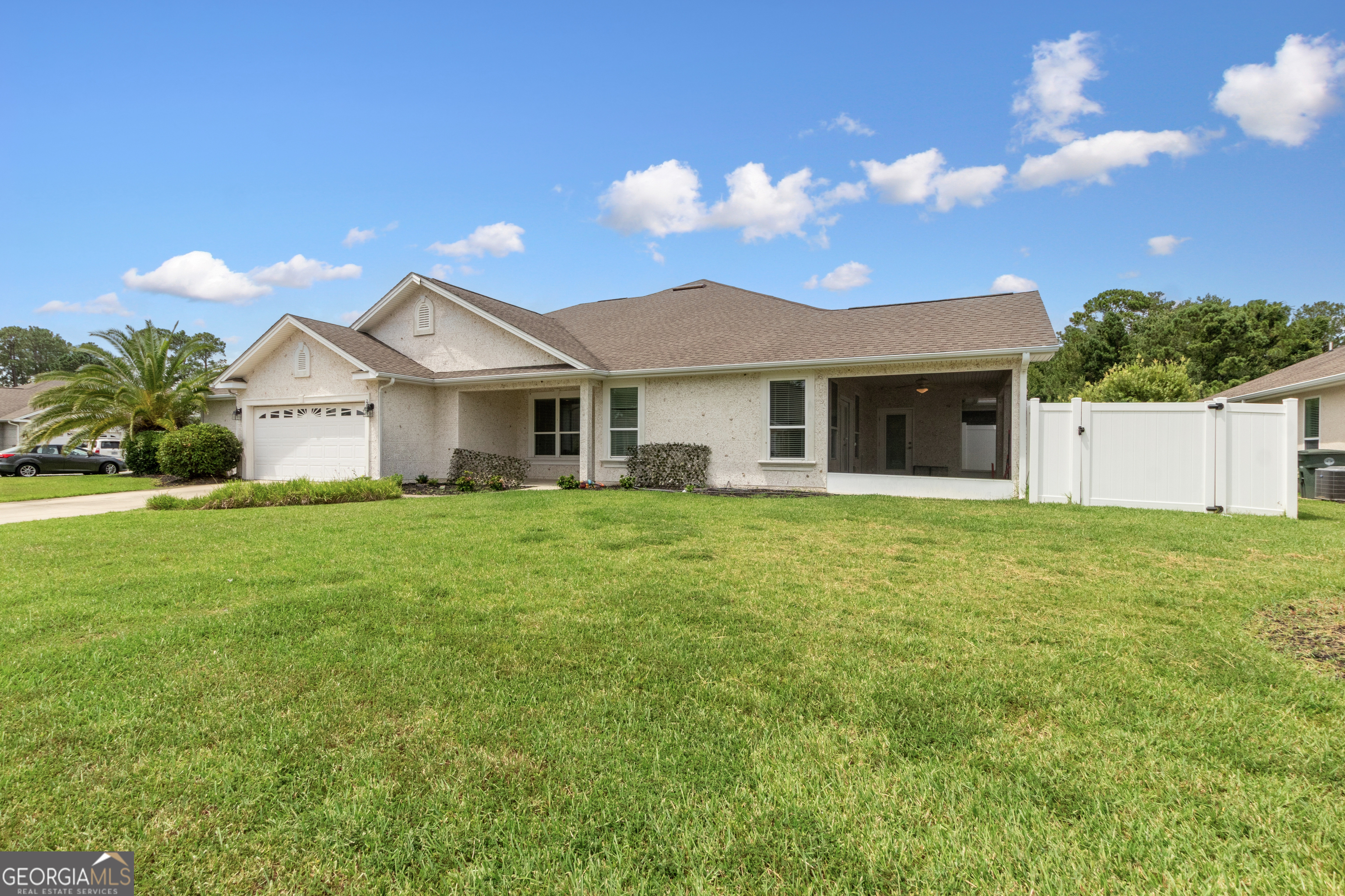 259 Laurel Landing Boulevard Kingsland, GA 31548 - Photo 3 of 43 a front view of a house with a garden
