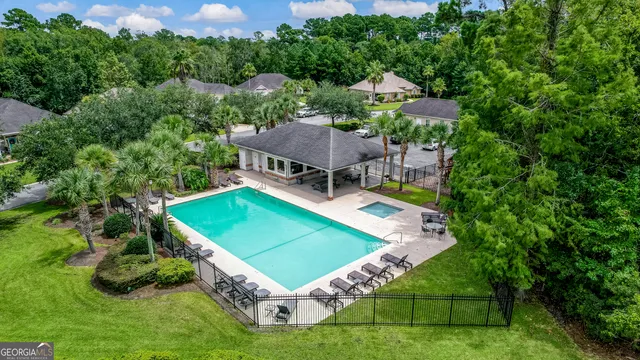an aerial view of a house with a garden