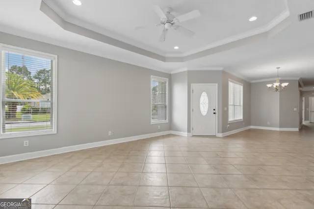 a view of an empty room with a window