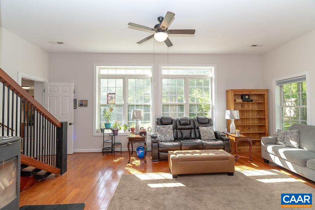2851 Martin Kings Road Scottsville, VA 24590 - Photo 28 of 67 a living room with furniture and floor to ceiling windows