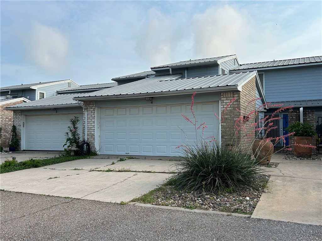 a front view of a house with a garage