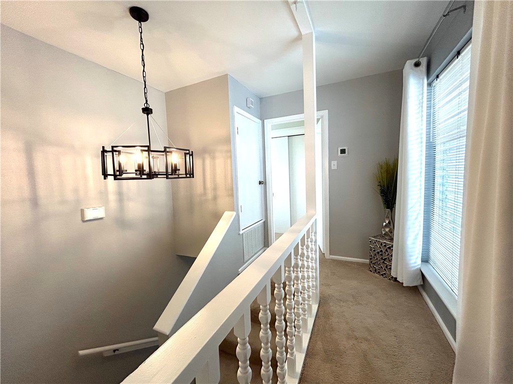 840 Cliff Drive, Unit 4 Portland, TX 78374 - Photo 15 of 32 a view of a hallway with windows and stairs