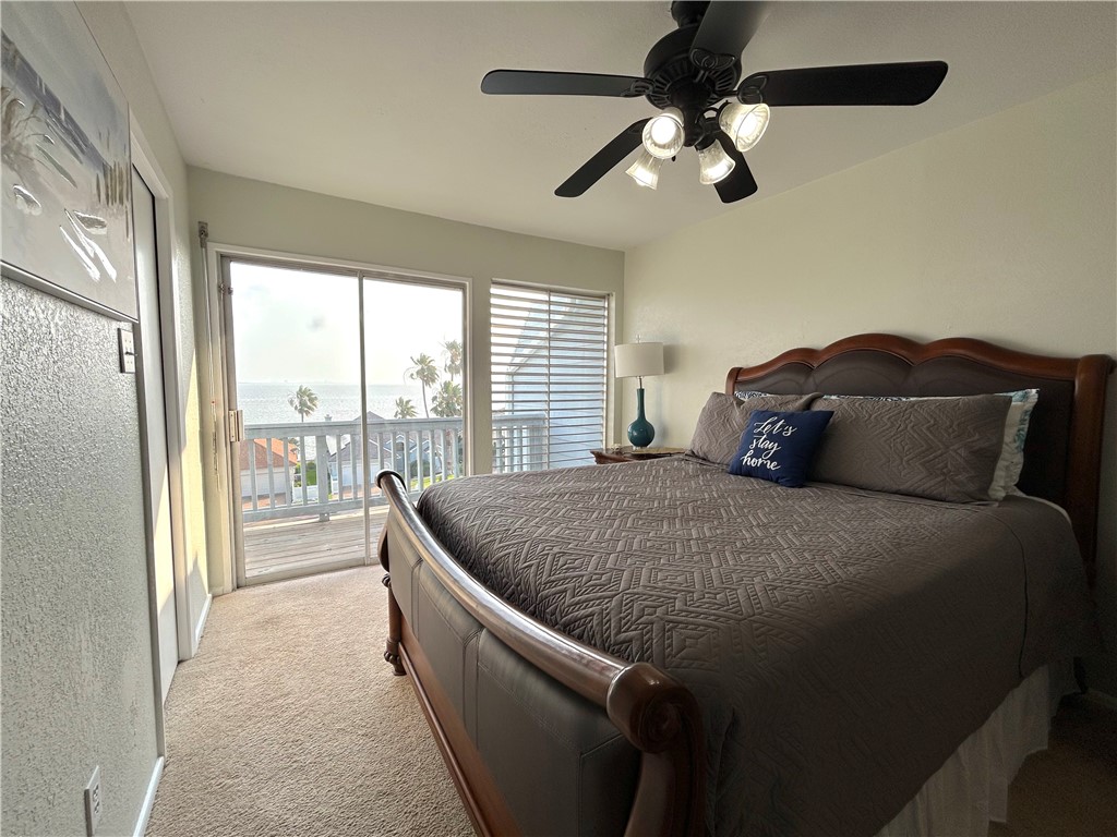 840 Cliff Drive, Unit 4 Portland, TX 78374 - Photo 16 of 32 a bed sitting in a bedroom next to a window