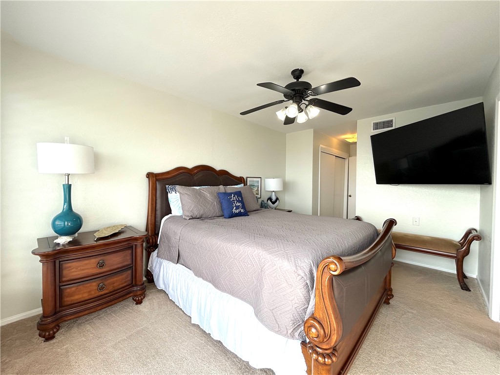 840 Cliff Drive, Unit 4 Portland, TX 78374 - Photo 17 of 32 a bedroom with a bed and a flat screen tv