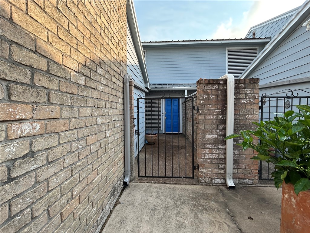 840 Cliff Drive, Unit 4 Portland, TX 78374 - Photo 2 of 32 a view of a small house with backyard