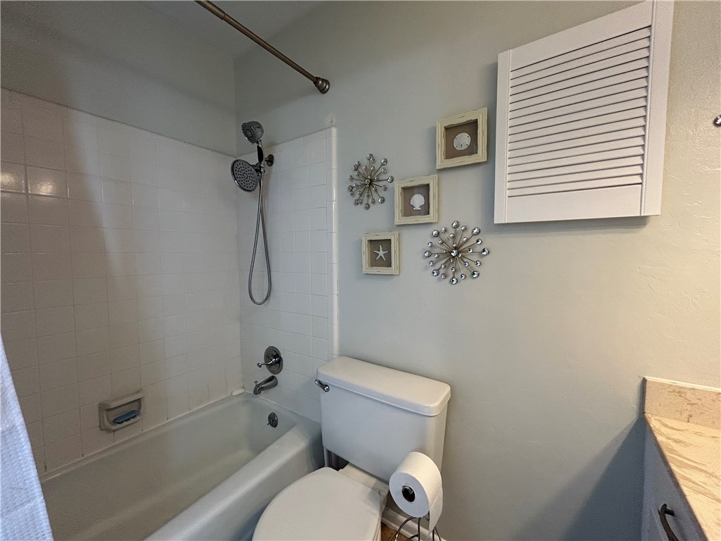 840 Cliff Drive, Unit 4 Portland, TX 78374 - Photo 21 of 32 a bathroom with a toilet and a shower