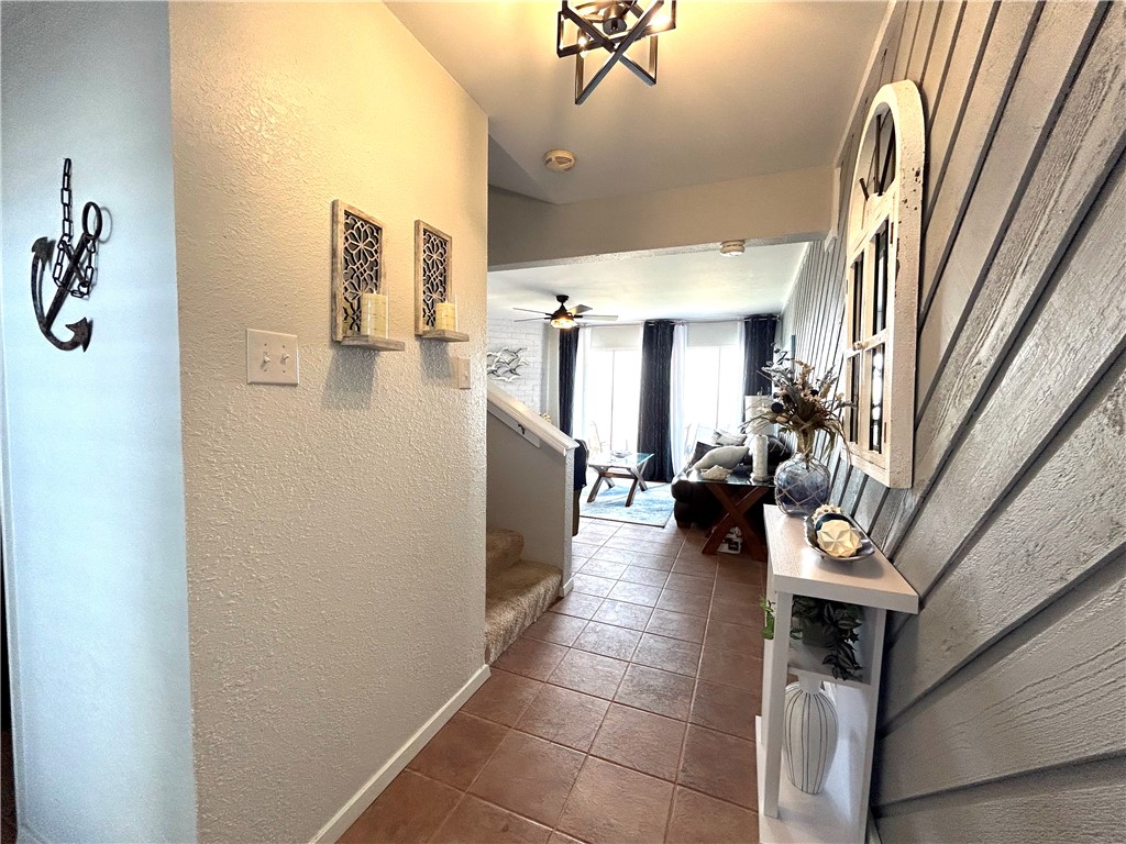 840 Cliff Drive, Unit 4 Portland, TX 78374 - Photo 5 of 32 a hall way with furniture a washer and dryer