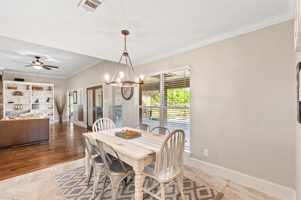 161 Pullen Road McLendon-Chisholm, TX 75032 - Photo 12 of 39 a view of a dining room with furniture window and wooden floor