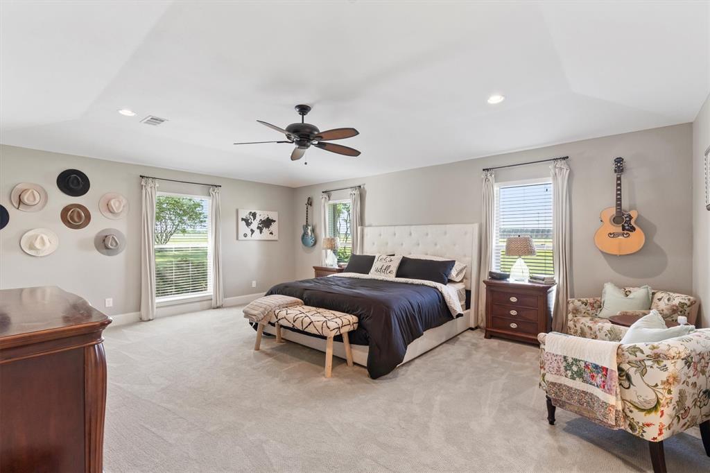 161 Pullen Road McLendon-Chisholm, TX 75032 - Photo 14 of 39 a spacious bedroom with a bed and a window