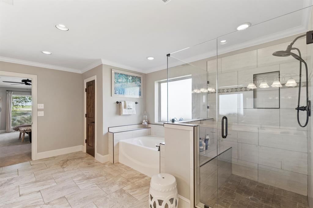 161 Pullen Road McLendon-Chisholm, TX 75032 - Photo 17 of 39 a large white kitchen with a refrigerator a sink dishwasher a fireplace and a dining table with wooden floor