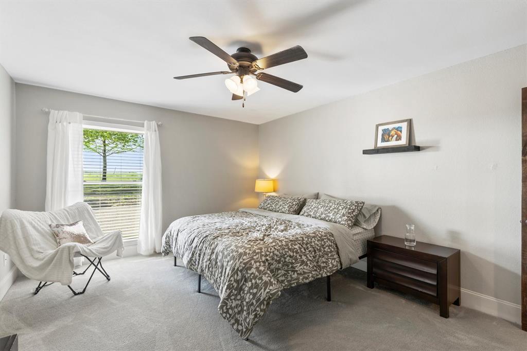 161 Pullen Road McLendon-Chisholm, TX 75032 - Photo 19 of 39 a bedroom with a bed and window