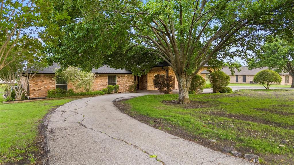 161 Pullen Road McLendon-Chisholm, TX 75032 - Photo 2 of 39 a front view of a house with a yard