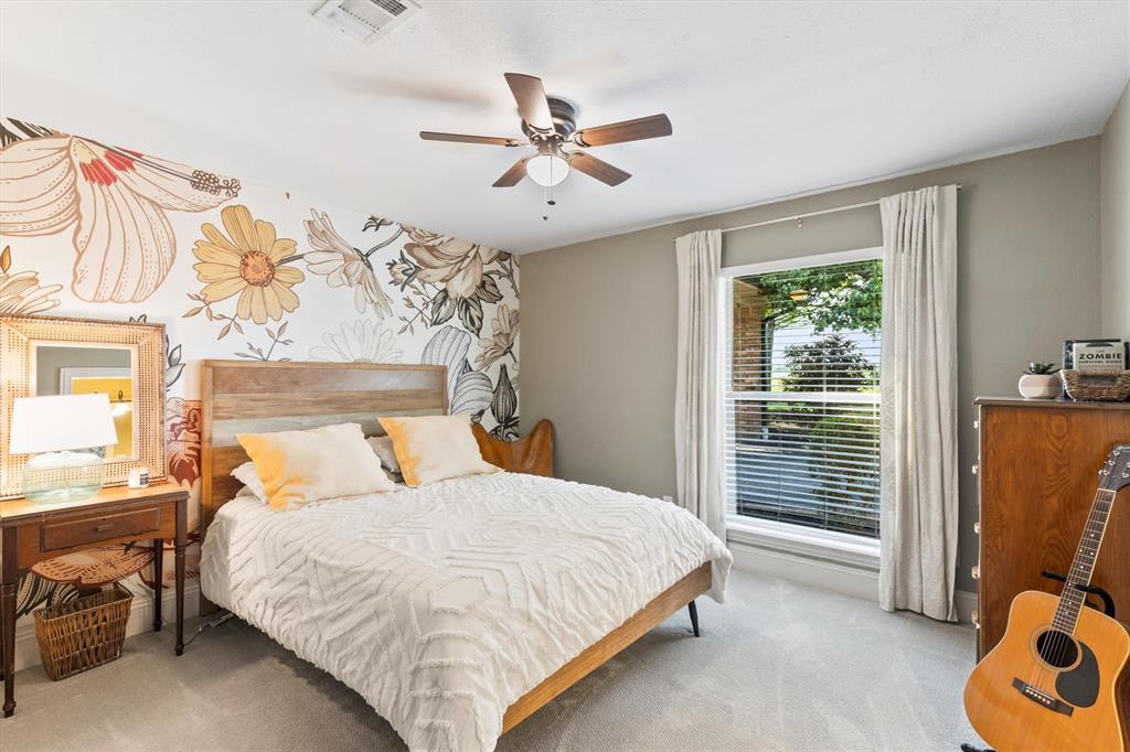 161 Pullen Road McLendon-Chisholm, TX 75032 - Photo 21 of 39 a bedroom with a bed and a window