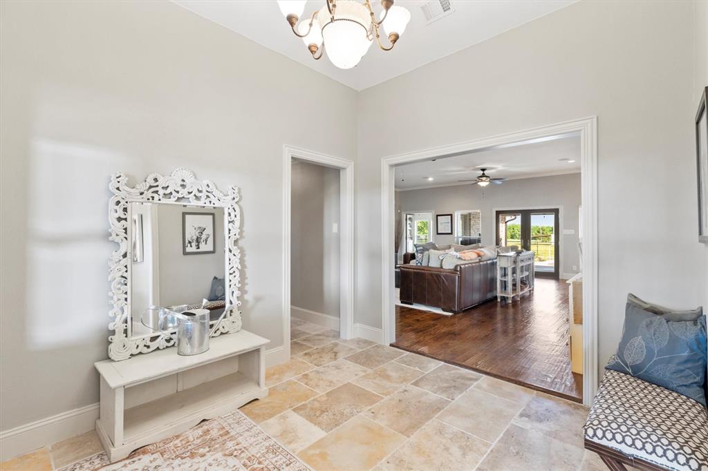 161 Pullen Road McLendon-Chisholm, TX 75032 - Photo 3 of 39 a living room with furniture and a chandelier