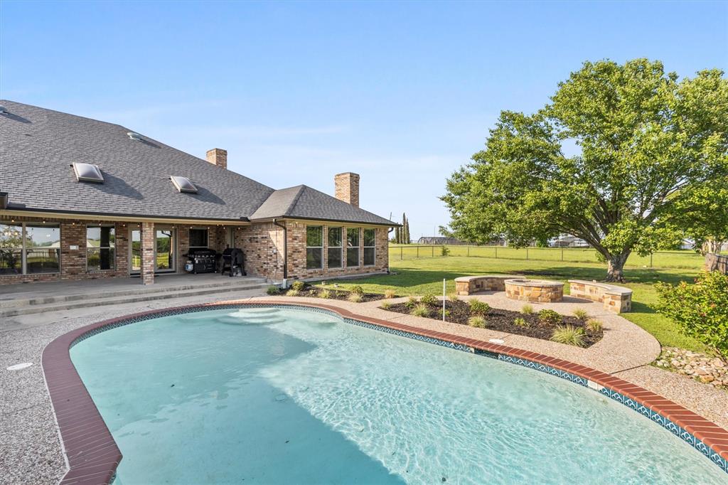 161 Pullen Road McLendon-Chisholm, TX 75032 - Photo 35 of 39 a view of a house with swimming pool and sitting area