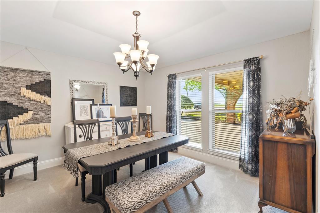 161 Pullen Road McLendon-Chisholm, TX 75032 - Photo 4 of 39 a view of a dining room with furniture a chandelier and wooden floor