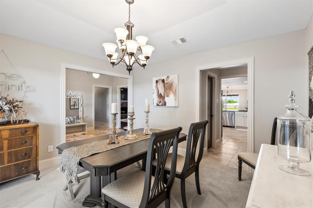 161 Pullen Road McLendon-Chisholm, TX 75032 - Photo 6 of 39 a view of a dining room with furniture and wooden floor