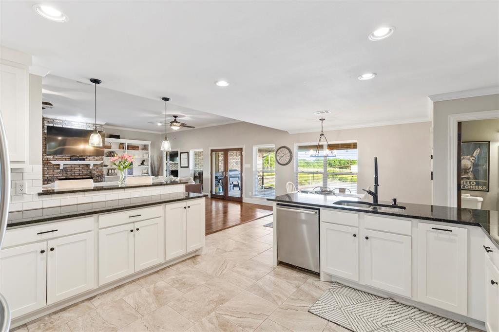 161 Pullen Road McLendon-Chisholm, TX 75032 - Photo 9 of 39 a large white kitchen with a large window