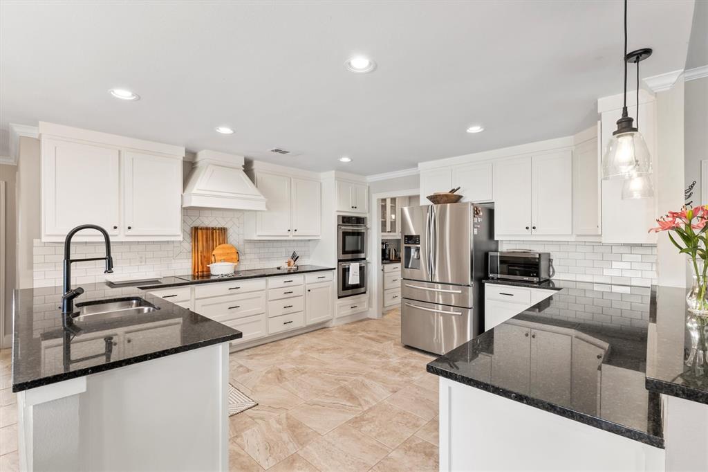 161 Pullen Road McLendon-Chisholm, TX 75032 - Photo 10 of 39 a kitchen with refrigerator and a sink