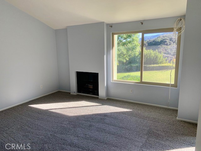 2641 Condor Circle Corona, CA 92882 - Photo 18 of 43 an empty room with fireplace