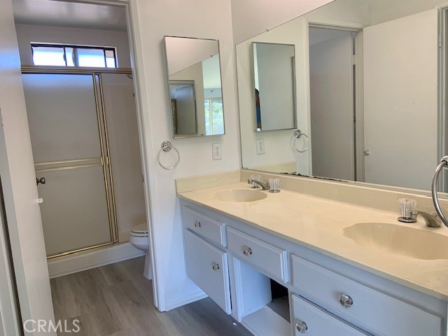 2641 Condor Circle Corona, CA 92882 - Photo 21 of 43 a bathroom with a double vanity sink and mirror