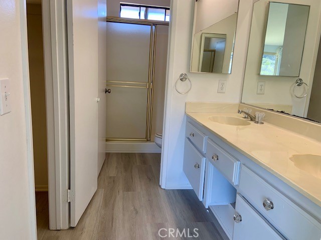 2641 Condor Circle Corona, CA 92882 - Photo 23 of 43 a spacious bathroom with a granite countertop sink mirror and vanity