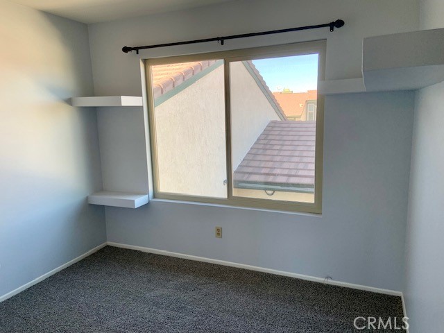 2641 Condor Circle Corona, CA 92882 - Photo 27 of 43 a view of an empty room with a window