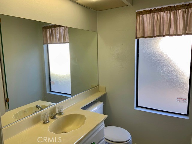 2641 Condor Circle Corona, CA 92882 - Photo 29 of 43 a bathroom with a sink and a mirror