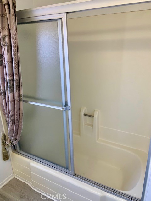 2641 Condor Circle Corona, CA 92882 - Photo 30 of 43 a bathroom with a glass shower door