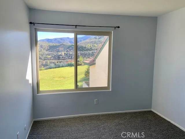 a view of a field with an ocean