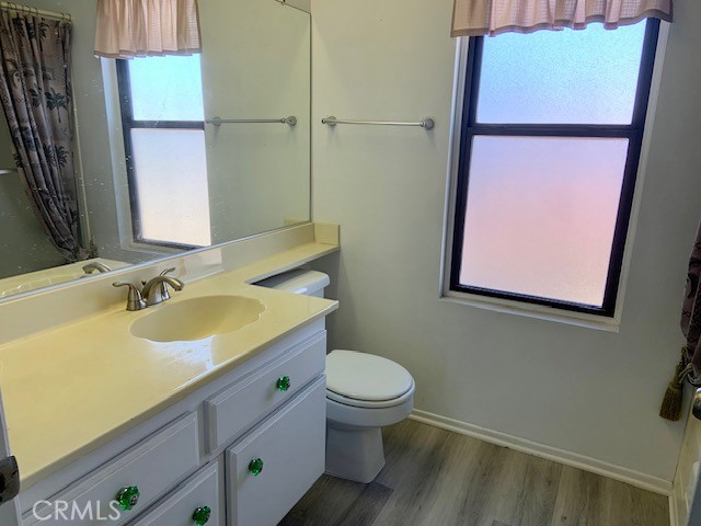 2641 Condor Circle Corona, CA 92882 - Photo 37 of 43 a bathroom with a granite countertop sink toilet and a mirror