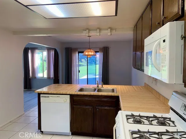 a kitchen with a stove and a cabinets