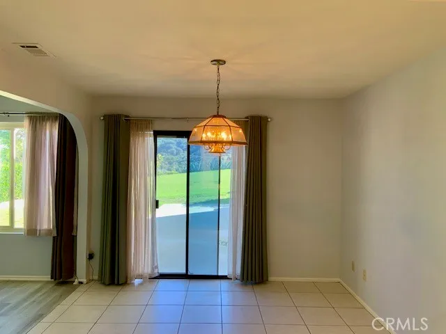 a view of a backyard with large trees