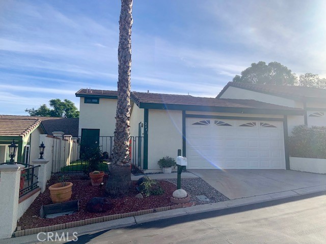 2641 Condor Circle Corona, CA 92882 - Photo 10 of 43 a front view of a house with garden
