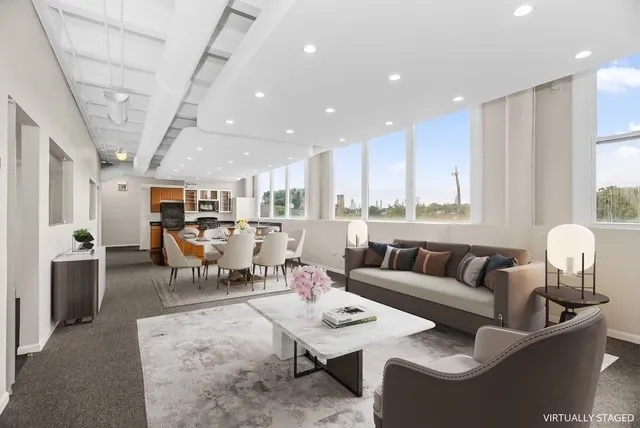 a living room with furniture and a table