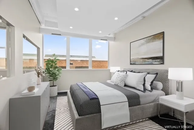 a bedroom with a bed and a couch