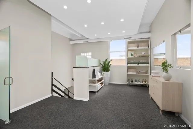 a view of livingroom with furniture and windows