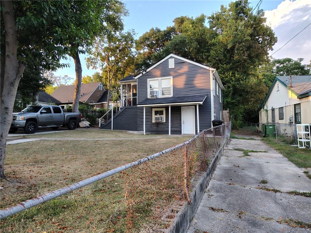 1113 35th Street Columbus, GA 31904 - Photo 2 of 9 a front view of a house with a yard and garage